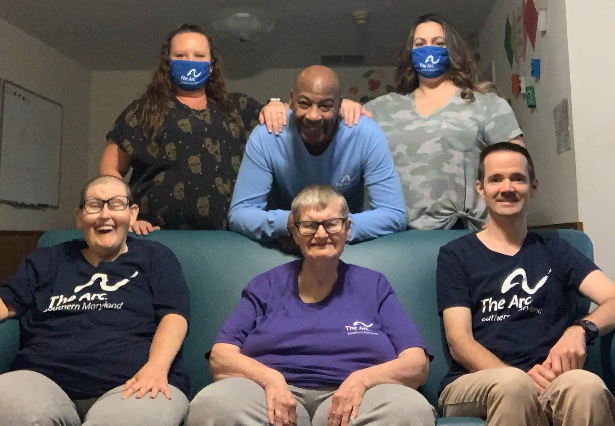 six of our work team all together smiling